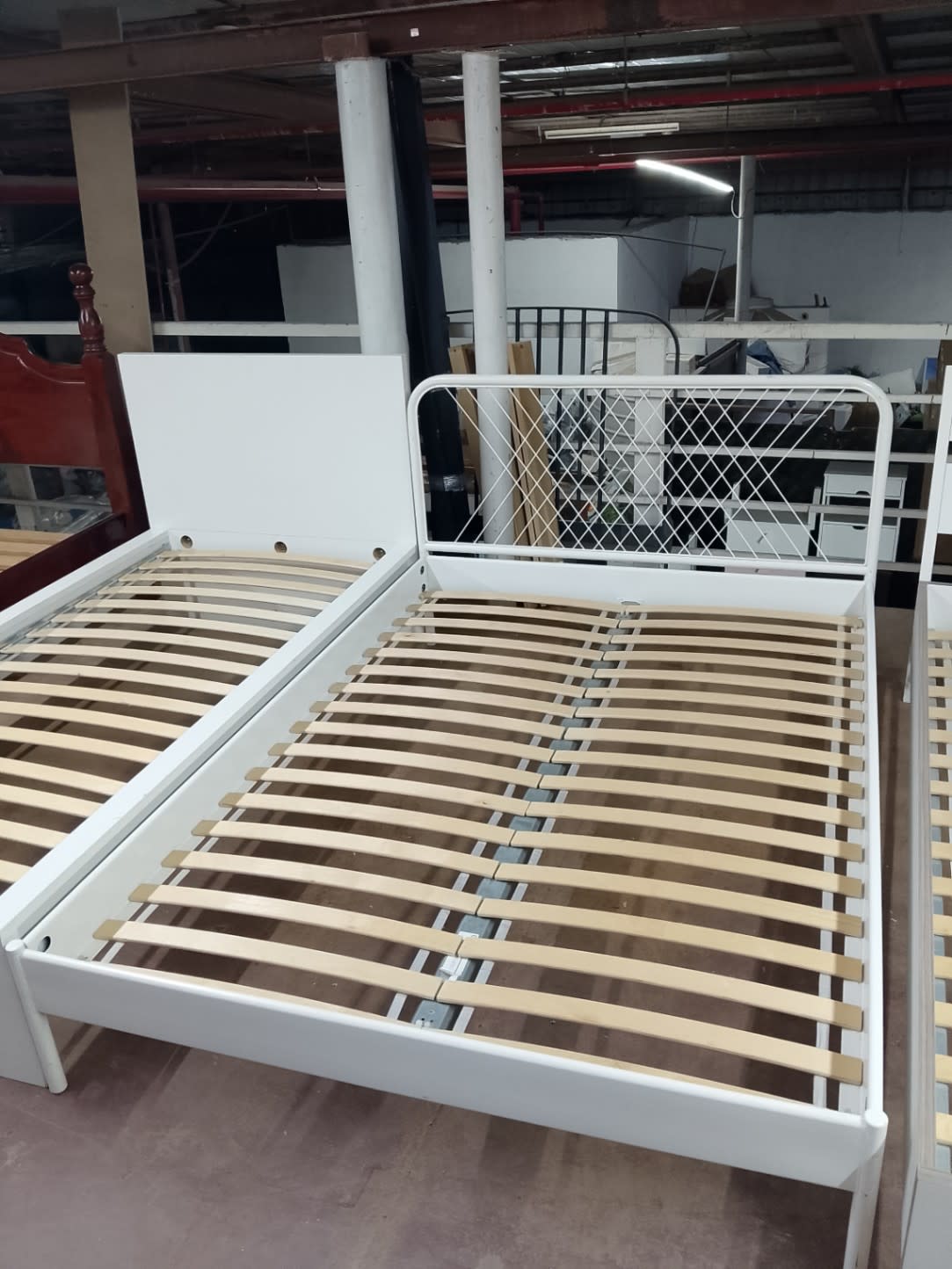 Barcode label for used white queen metal bed frame at Bufaisal Shop D Ajman
