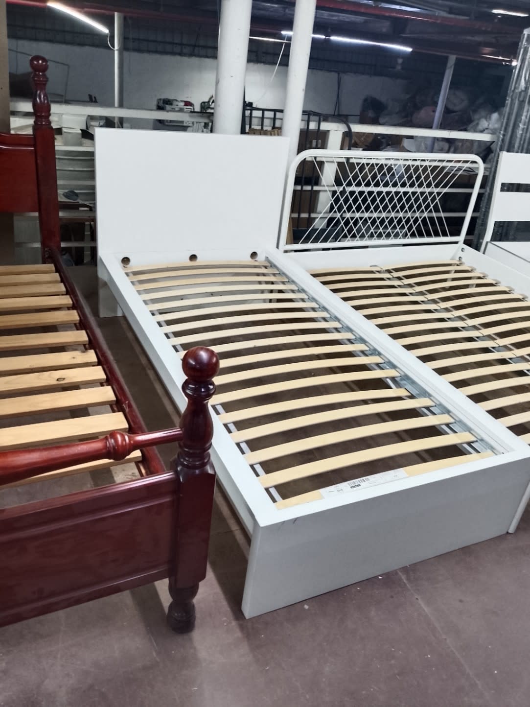 Bufaisal item label on used single white bed frame