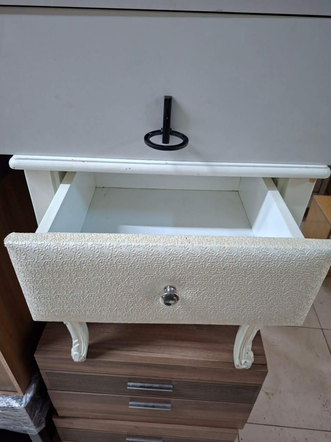 Used cream bedside table with upper drawer open showing clean drawer box at Bufaisal Ajman