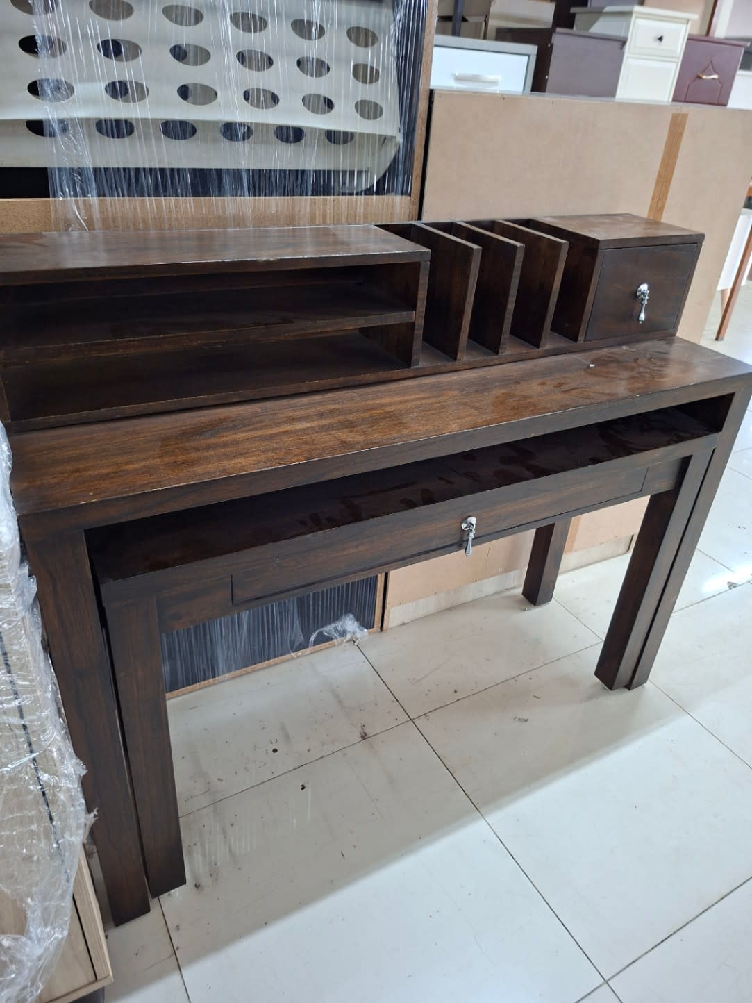 Side angle of used dark brown wooden writing desk with hutch organiser at Bufaisal Ajman