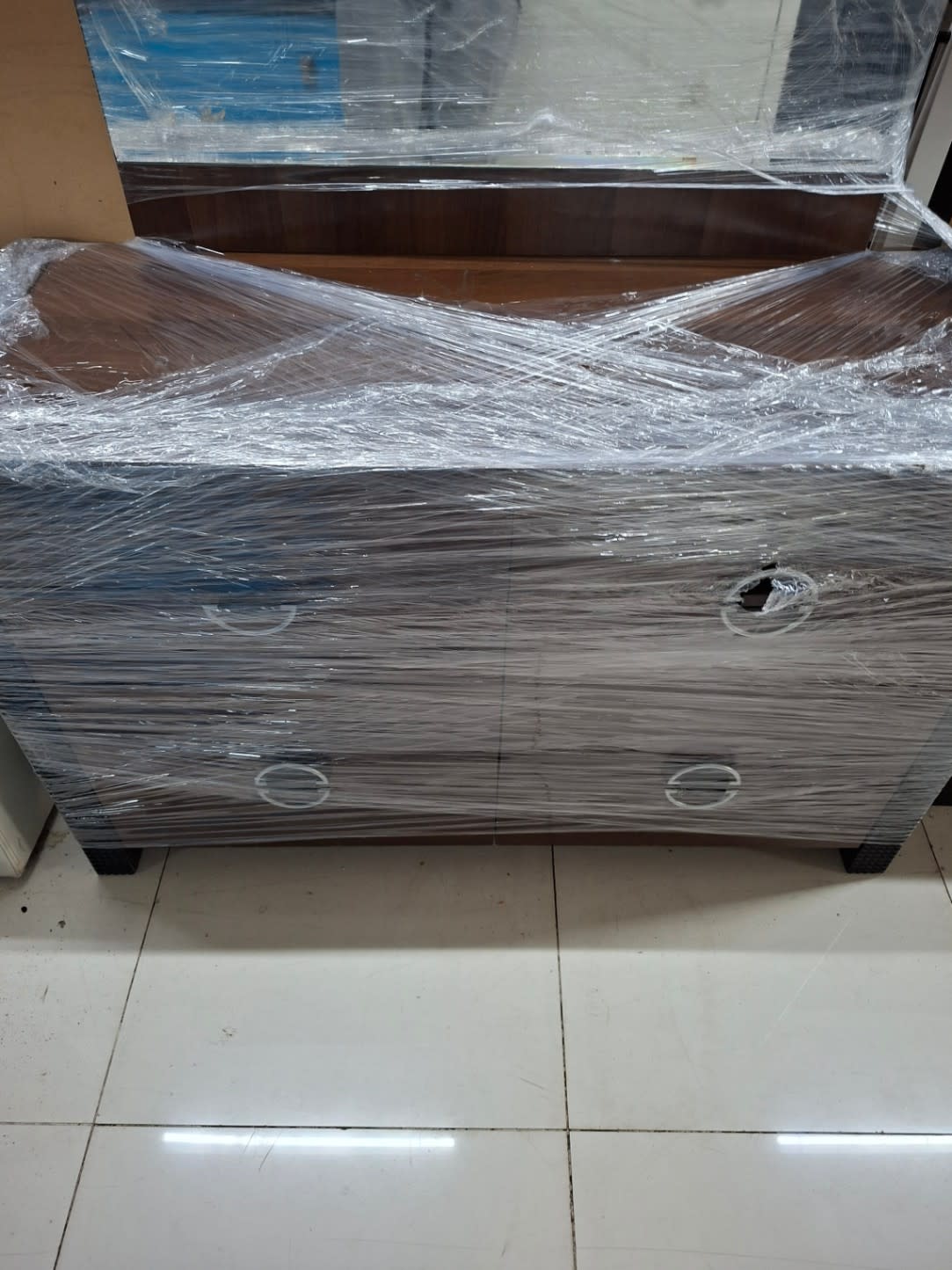 Front-facing view of 3-drawer base of used dressing table with walnut laminate finish at Bufaisal Shop C