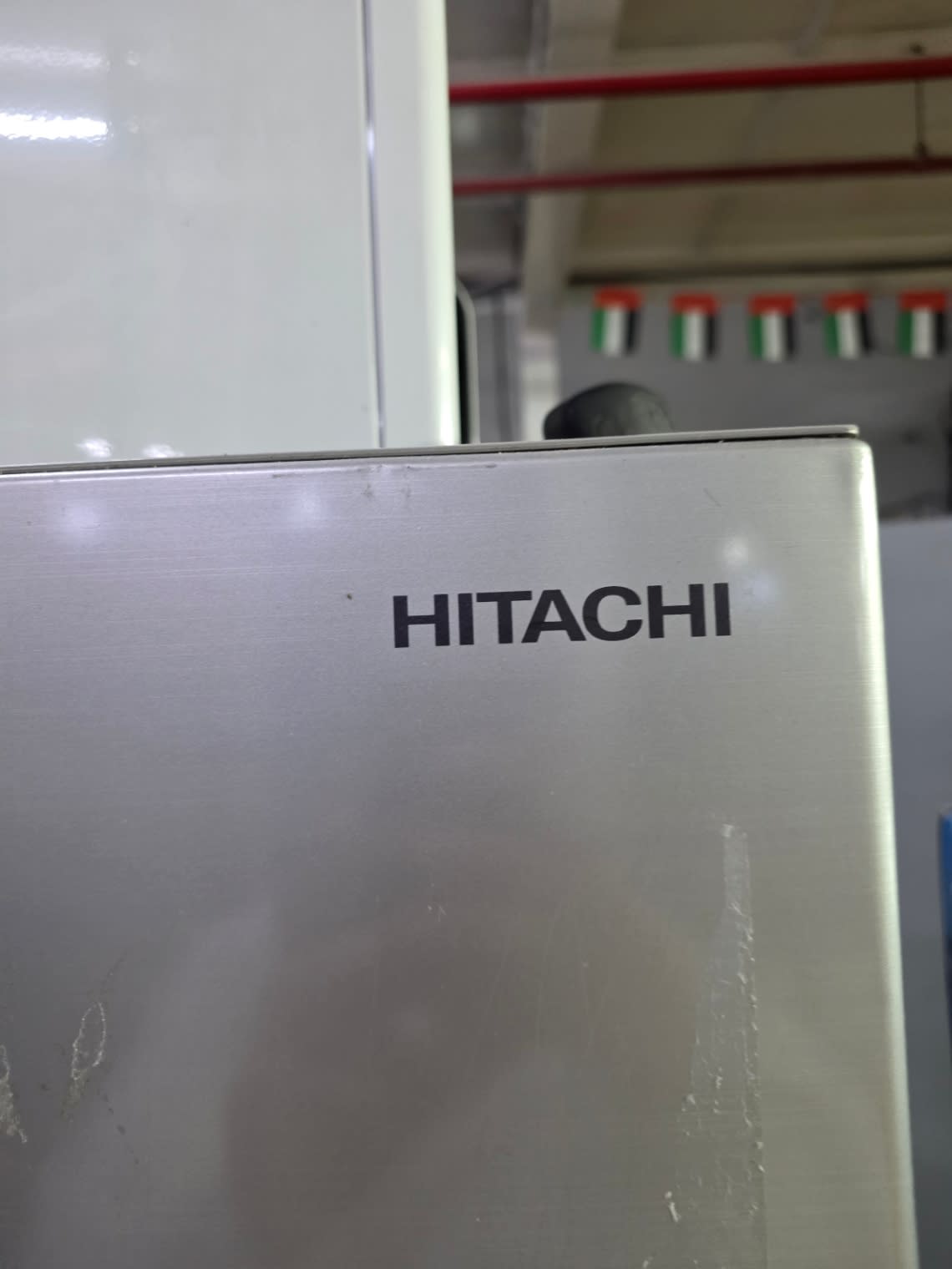 Bufaisal barcode label area for used Hitachi Inverter top-mount refrigerator at Shop B Ajman
