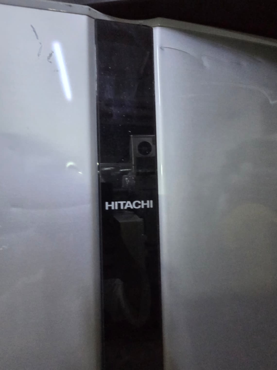 Bufaisal barcode label for used Hitachi top-mount refrigerator at Shop B Ajman