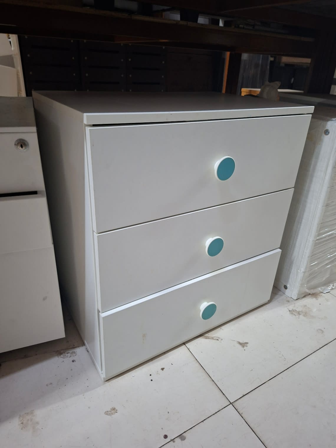 Side angle of used white 3-drawer chest of drawers at Bufaisal Shop C Ajman