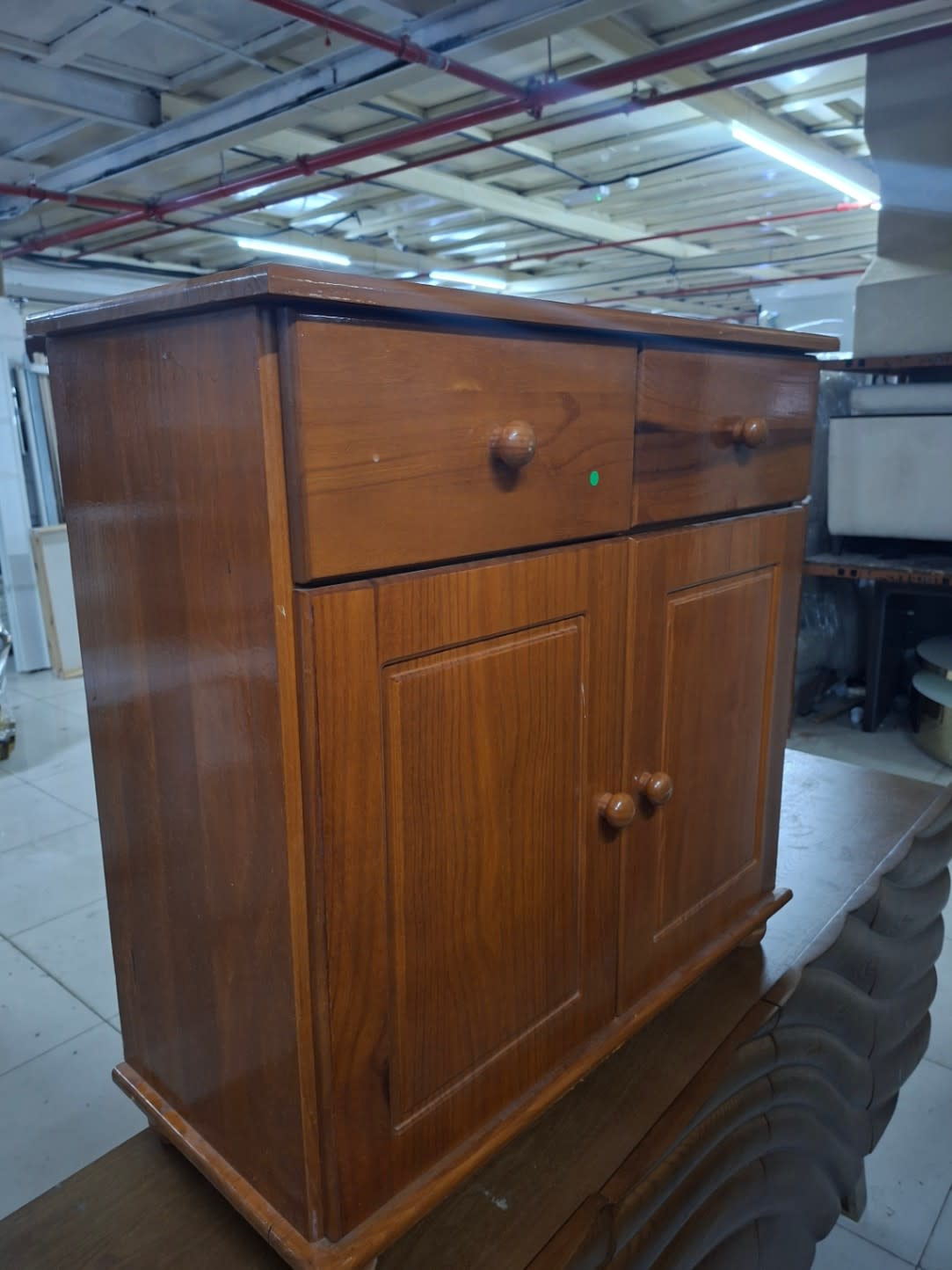 Bufaisal barcode label photo for used wooden storage cabinet at Shop C Ajman