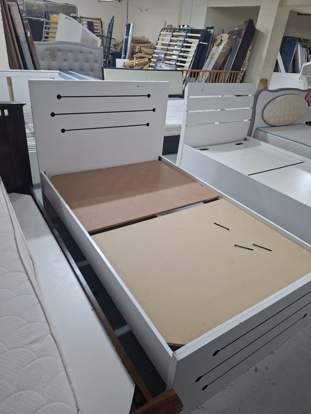 Bufaisal barcode label for used white single bed frame — label unreadable in photo