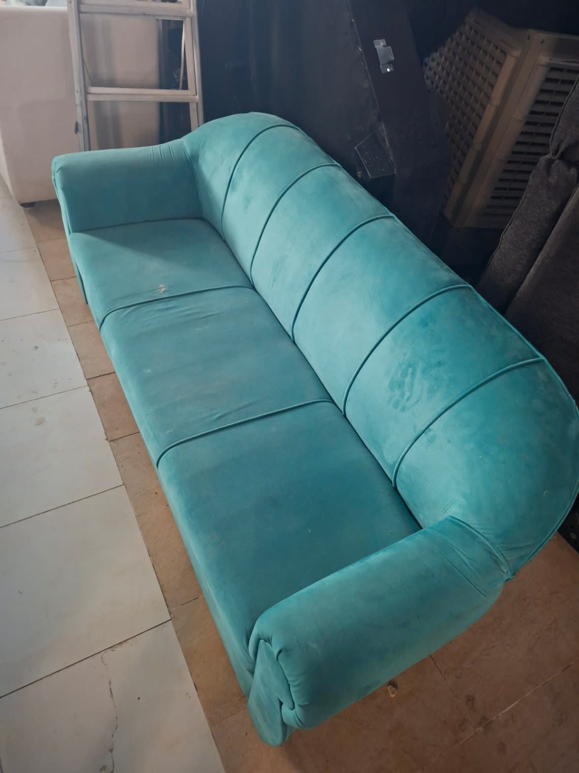 Overhead angle of used teal velvet 3-seater sofa showing full seat and backrest condition