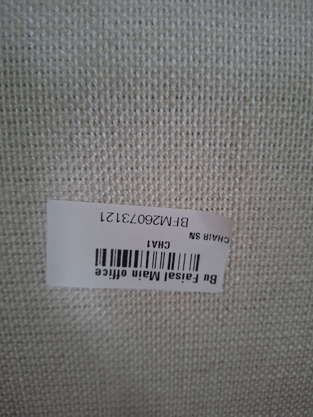 Bufaisal barcode label BFM26073121 on used cream fabric accent armchair
