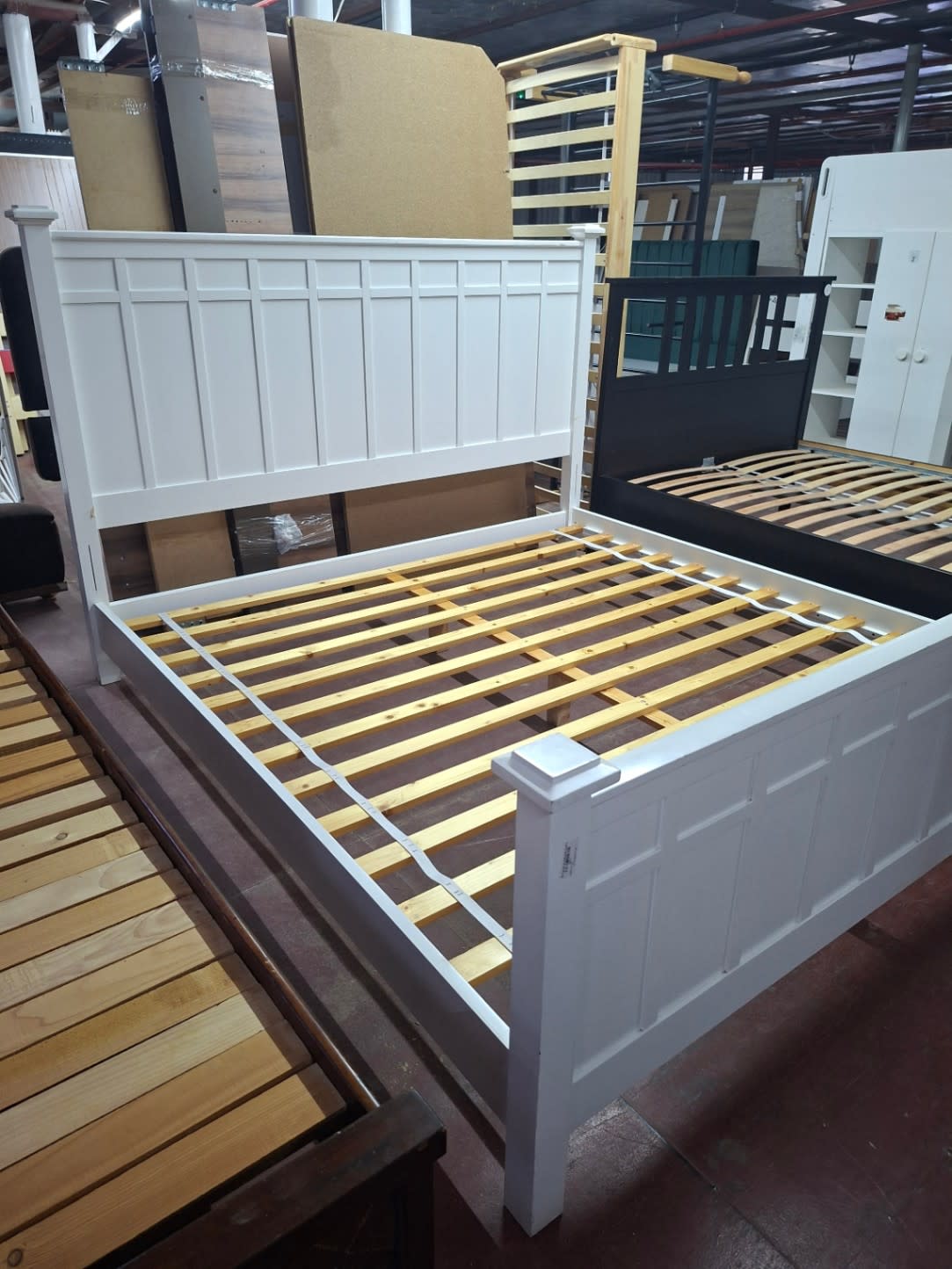 Bufaisal barcode label for used white queen bed frame at Shop D Ajman