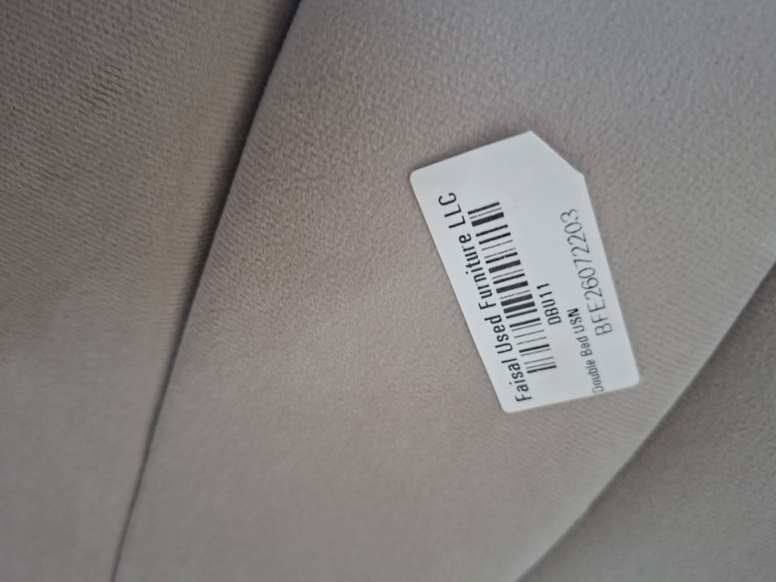 Bufaisal barcode label BFE26072203 for used double bed frame, Shop E Ajman