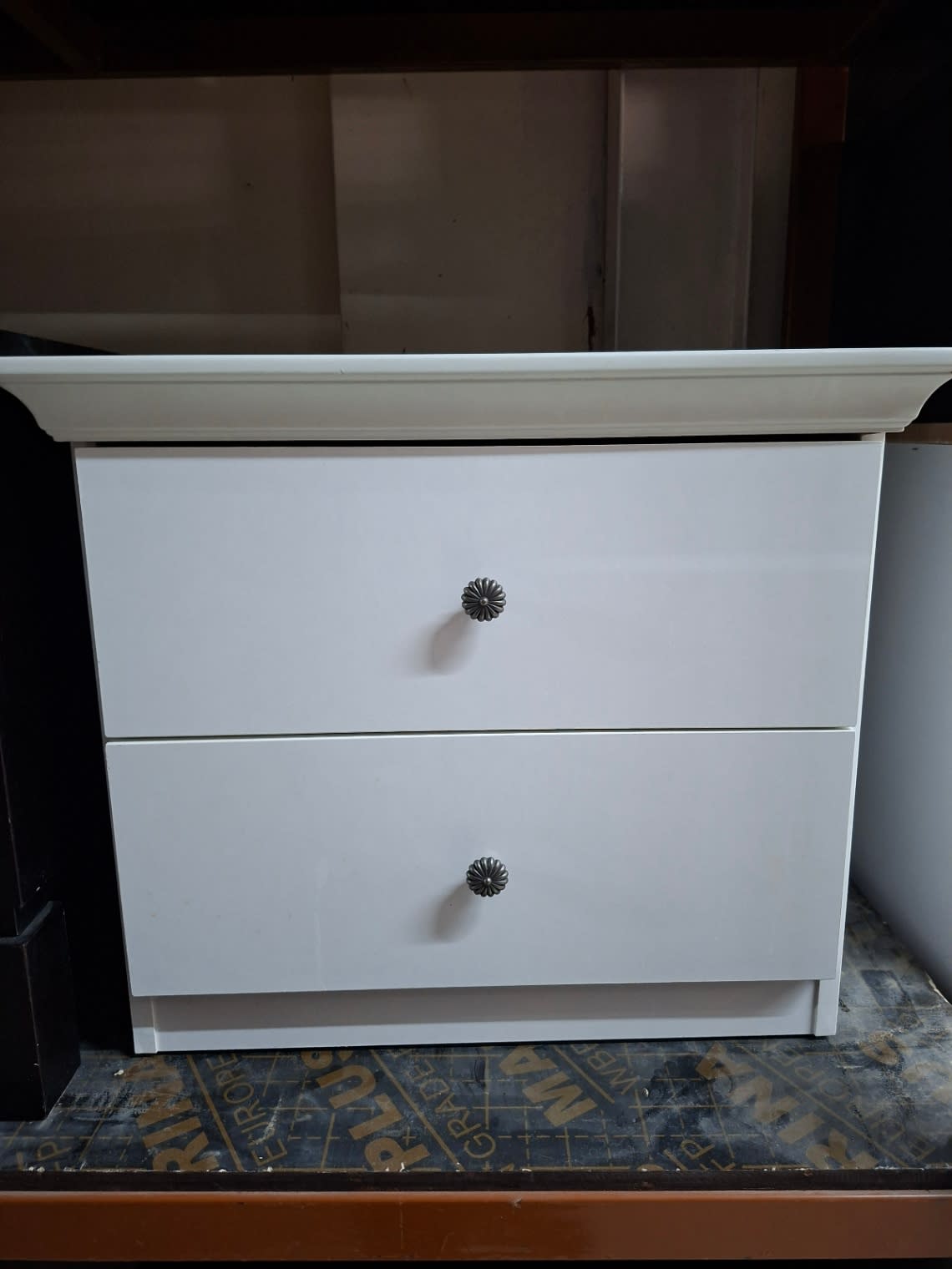 Used white 2-drawer bedside table full front view, good condition, available at Shop C Ajman