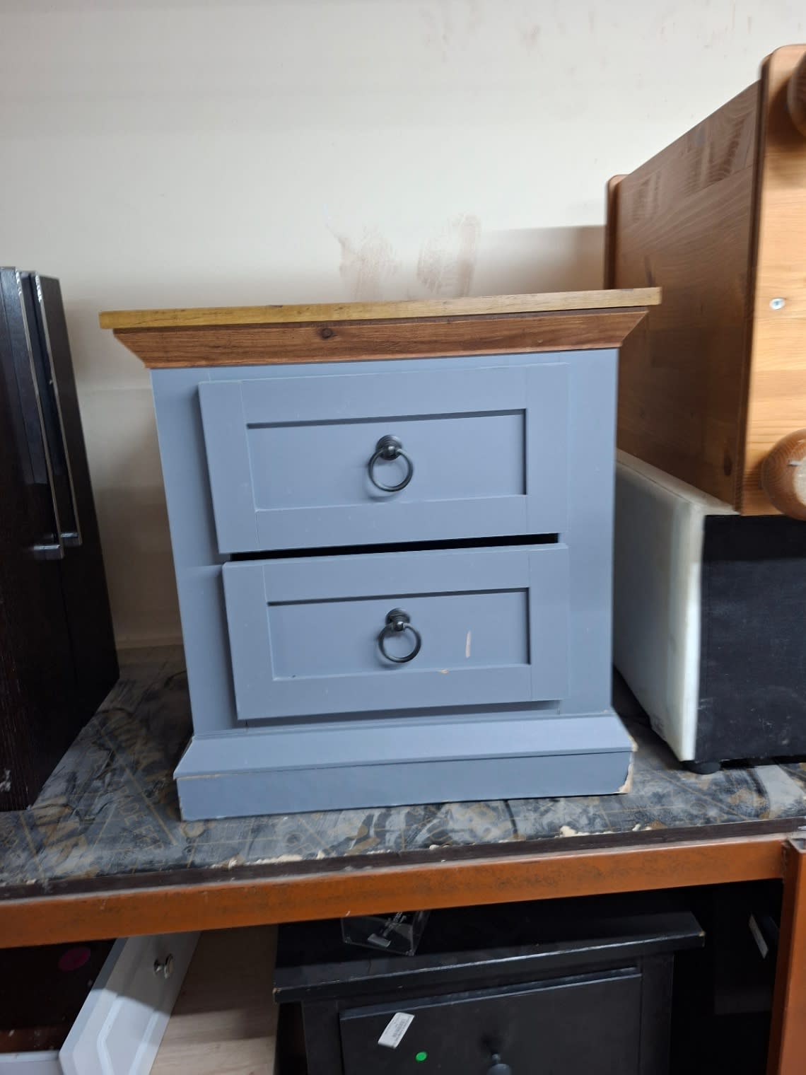 Used 2-drawer bedside table grey wood top, additional front angle view at Bufaisal Ajman
