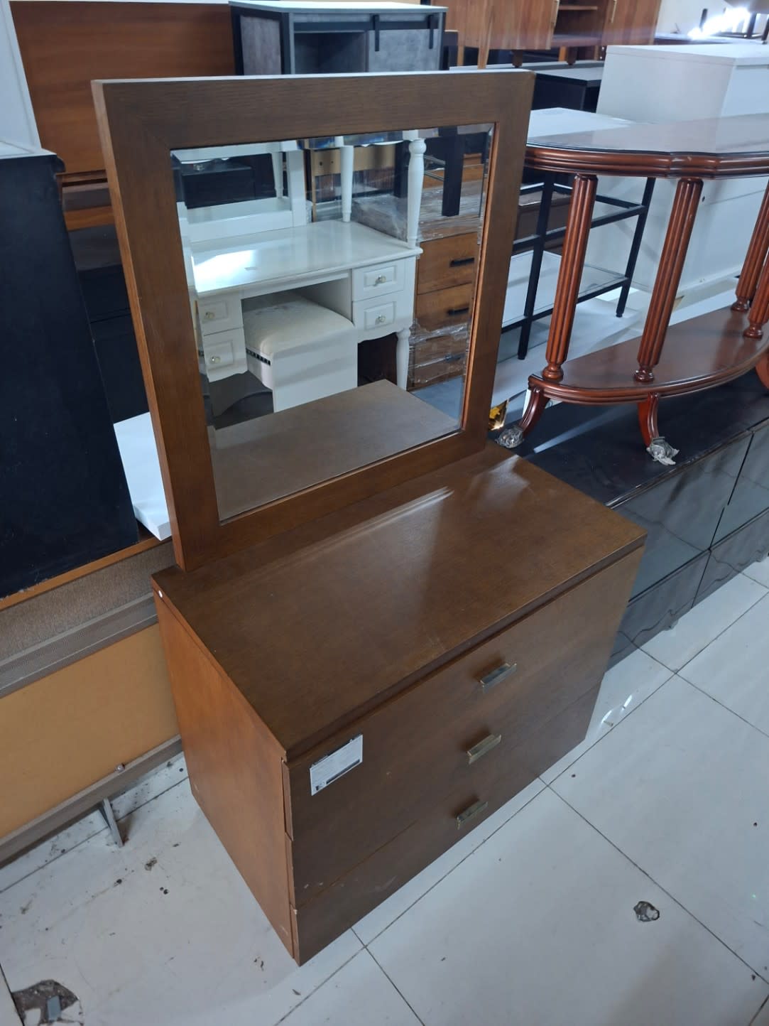 Bufaisal barcode label on used 3-drawer dressing table with mirror at Shop C Ajman