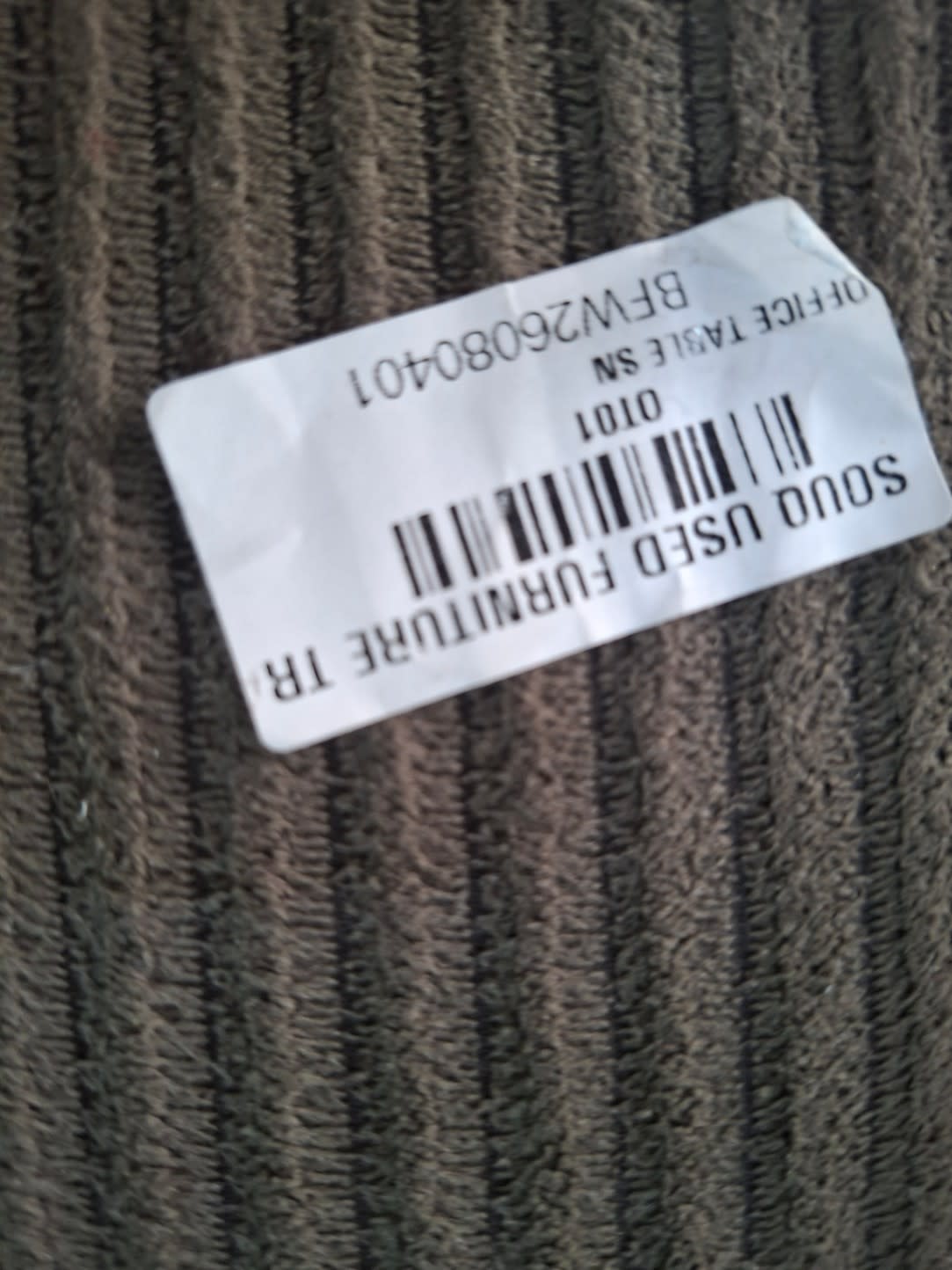 Bufaisal barcode label BFW26080401 on used L-shape sectional sofa