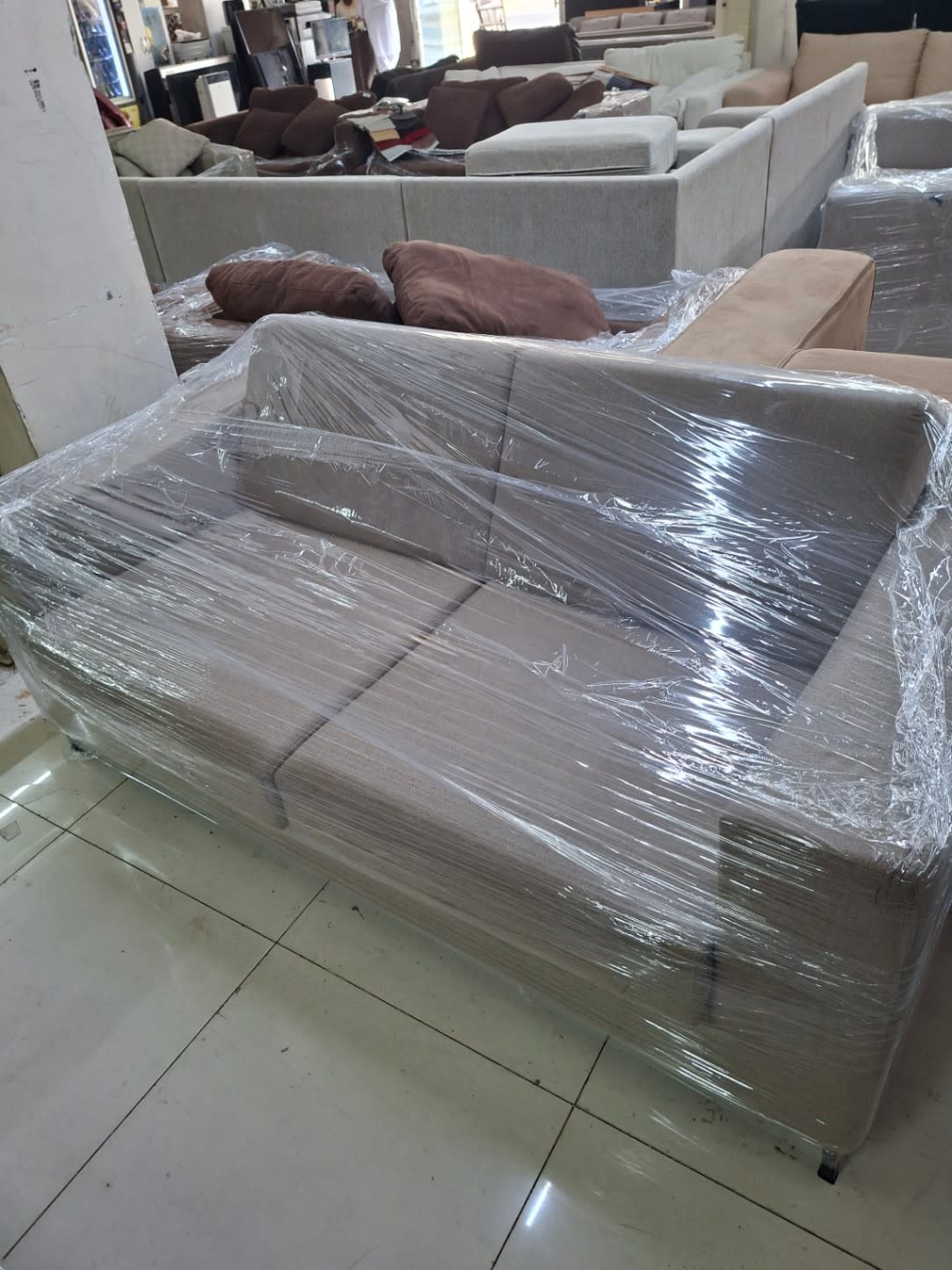 Bufaisal barcode label for used L-shape sectional sofa at Shop C Ajman
