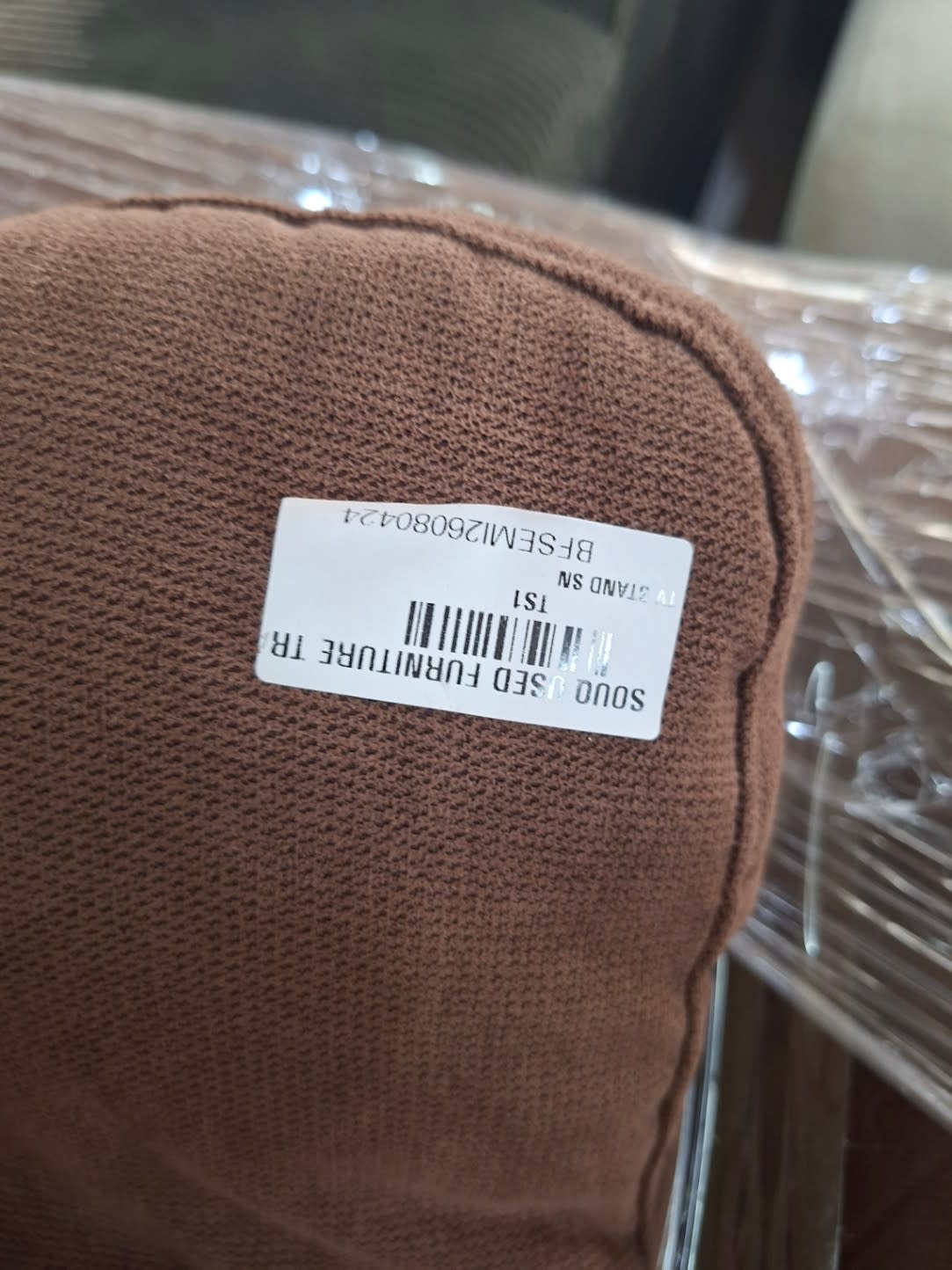 Bufaisal barcode label BFSEMI26080424 on used brown 2-seater fabric sofa