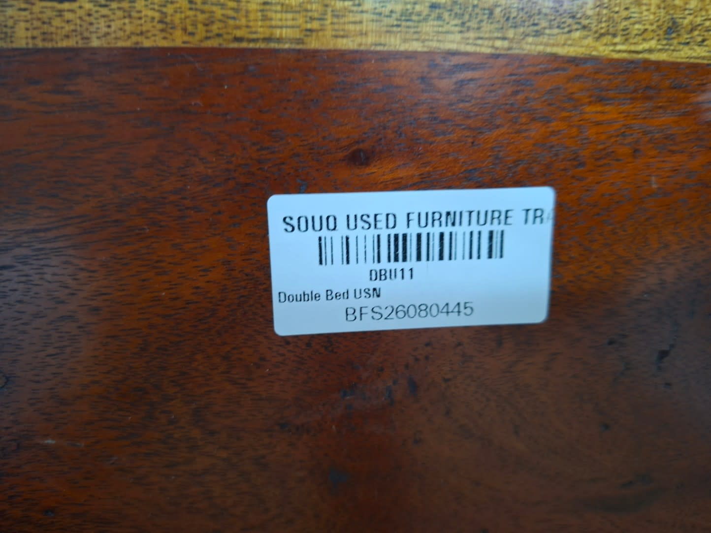 Bufaisal barcode label BFS26080445 for used double bed frame at Shop C Ajman