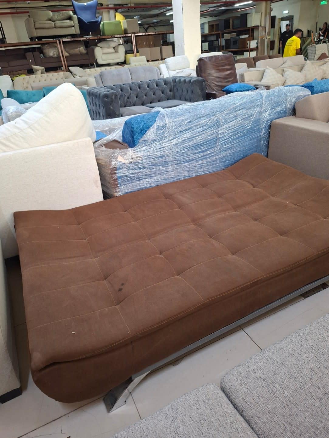 Bufaisal barcode label for used brown fabric sofa bed — label unreadable