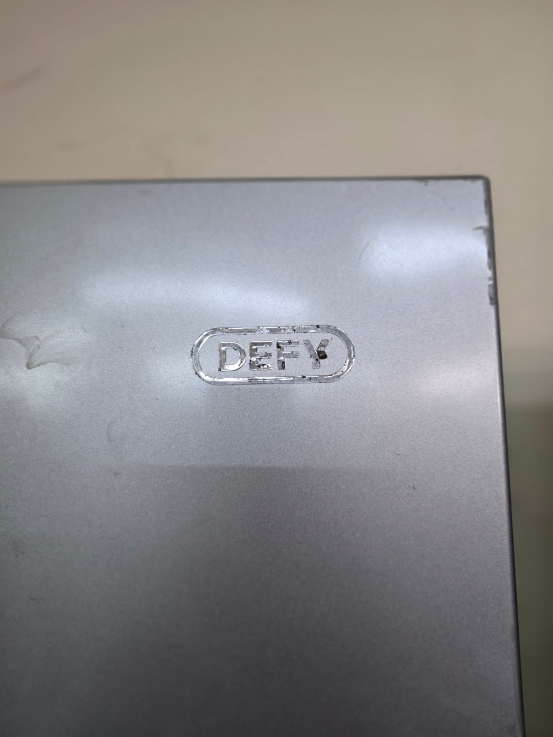Bufaisal barcode label for used DEFY side-by-side refrigerator at Shop C Ajman