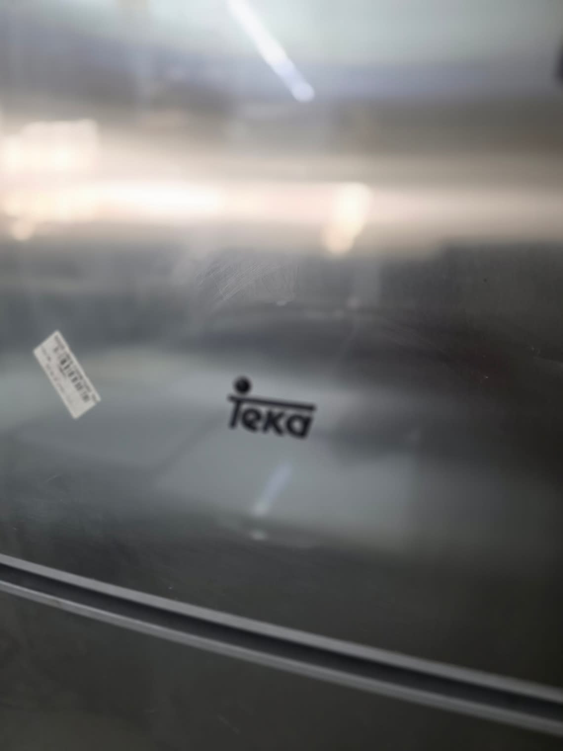 Barcode label on used Teka top-mount refrigerator at Bufaisal Shop C Ajman
