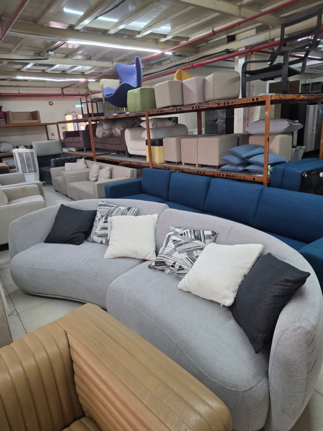 Bufaisal barcode label for used curved sectional sofa at Shop C Ajman