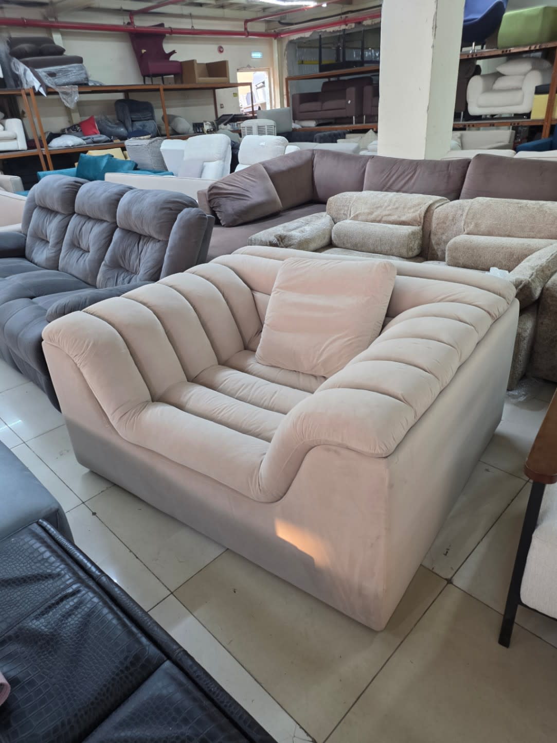 Bufaisal item barcode label for used oversized beige accent chair at Shop C Ajman