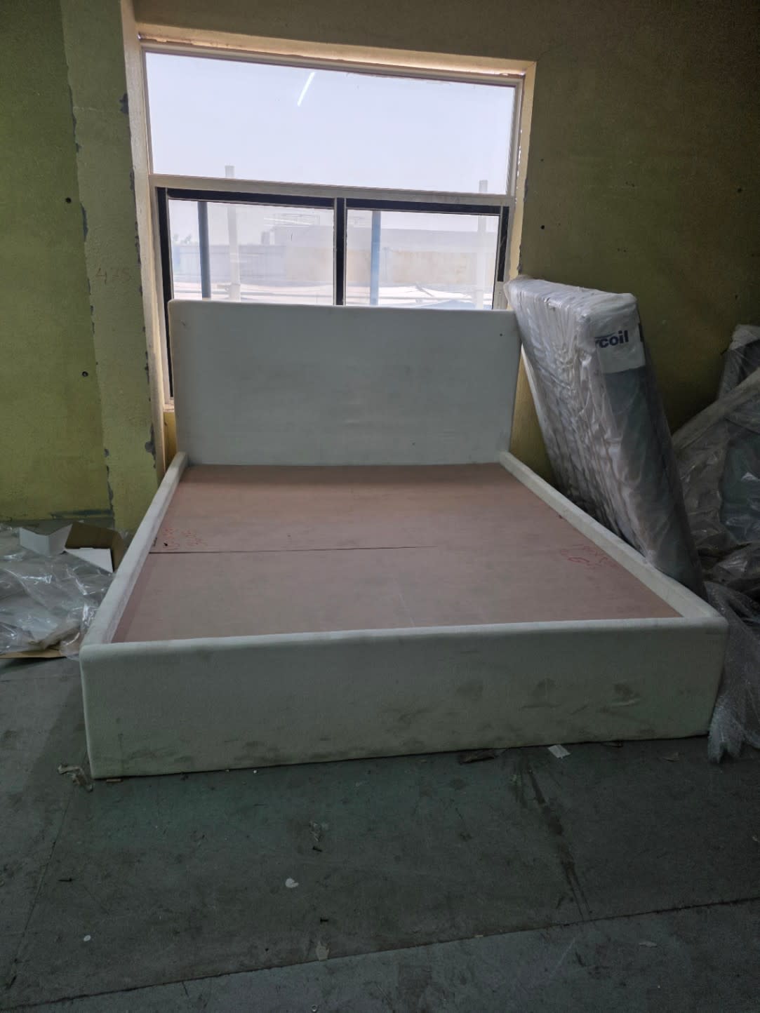 Bufaisal barcode label for used cream upholstered queen bed frame