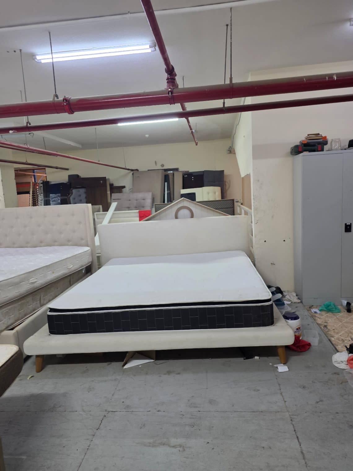 Bufaisal barcode label for used king bed frame at Shop C Ajman