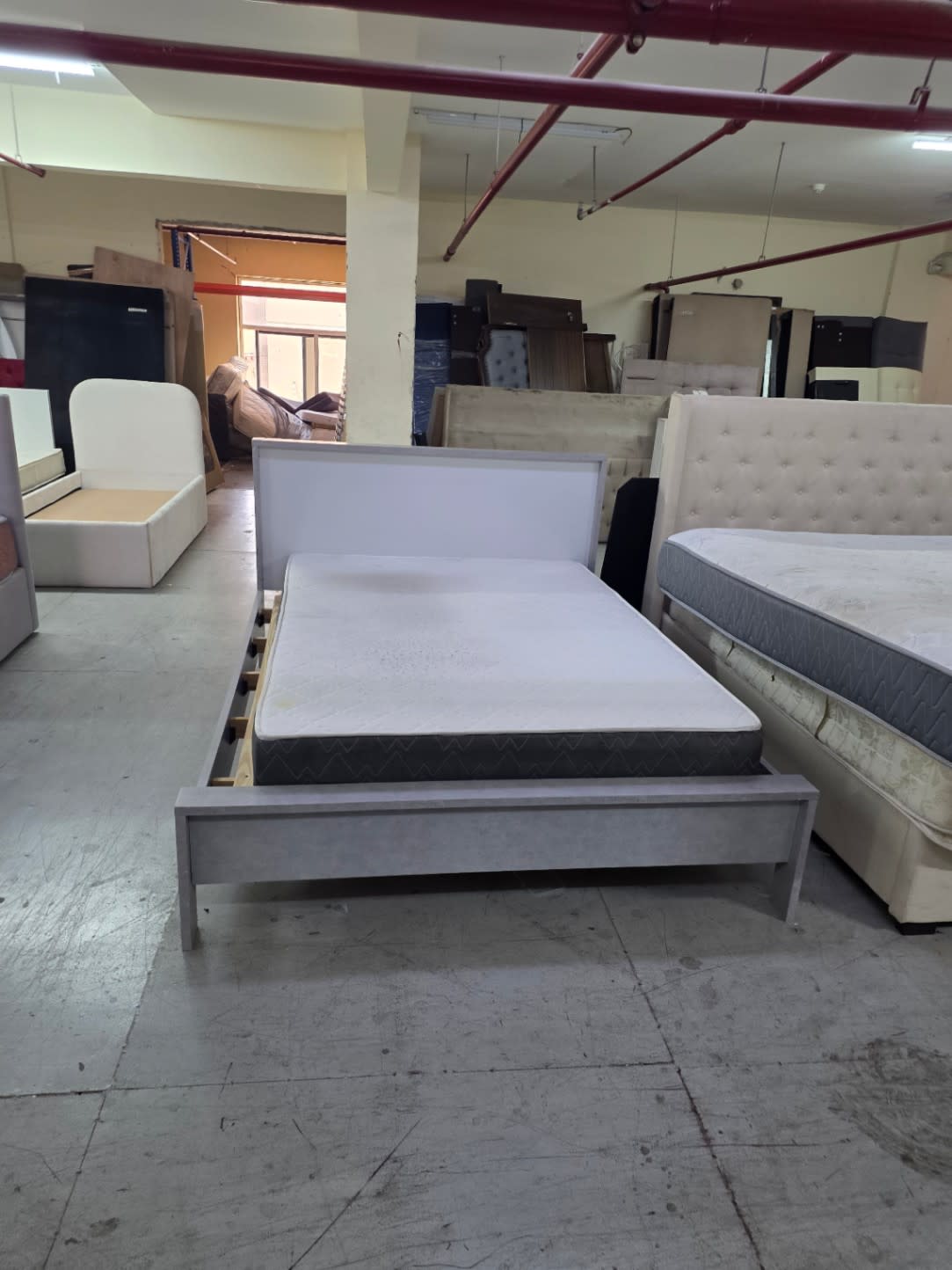 Bufaisal barcode label for used queen bed frame at Shop C Ajman
