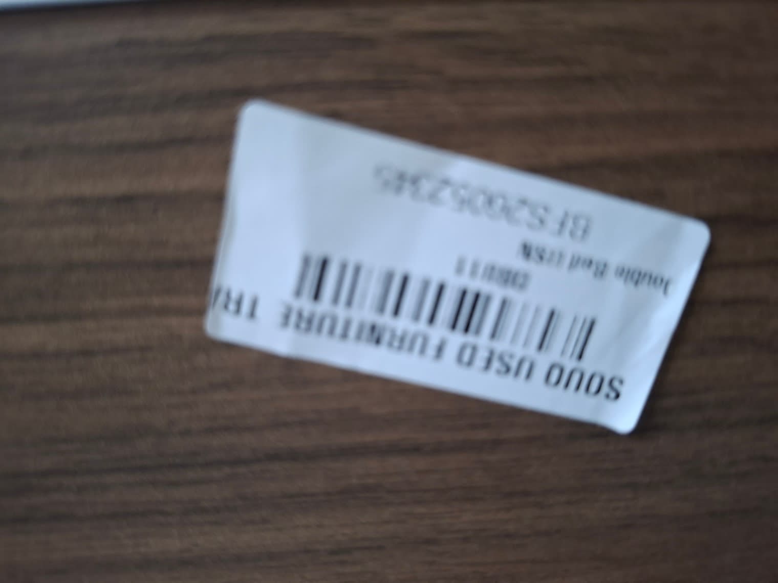 Bufaisal barcode label BFS26002346 for used double bed frame at Shop C Ajman