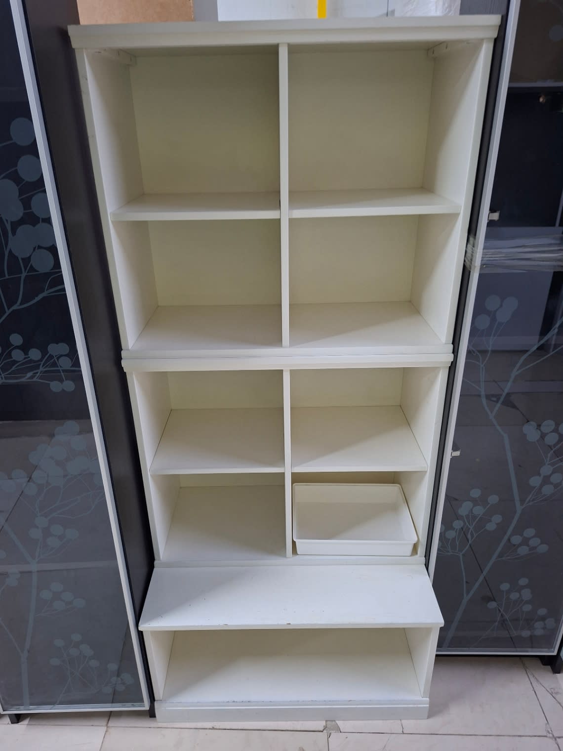 Bufaisal barcode label for used white open shelving unit at Shop C Ajman