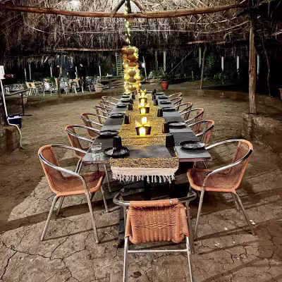special occasion dining setup at Limkheda - our on-site open ground for open sky dining, parties, cultural activities and more.