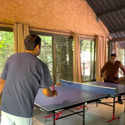 two guests enjoying a round of table tennis