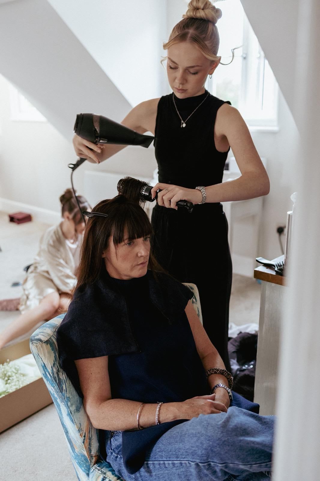 Faith Peel reflected in the salon mirror