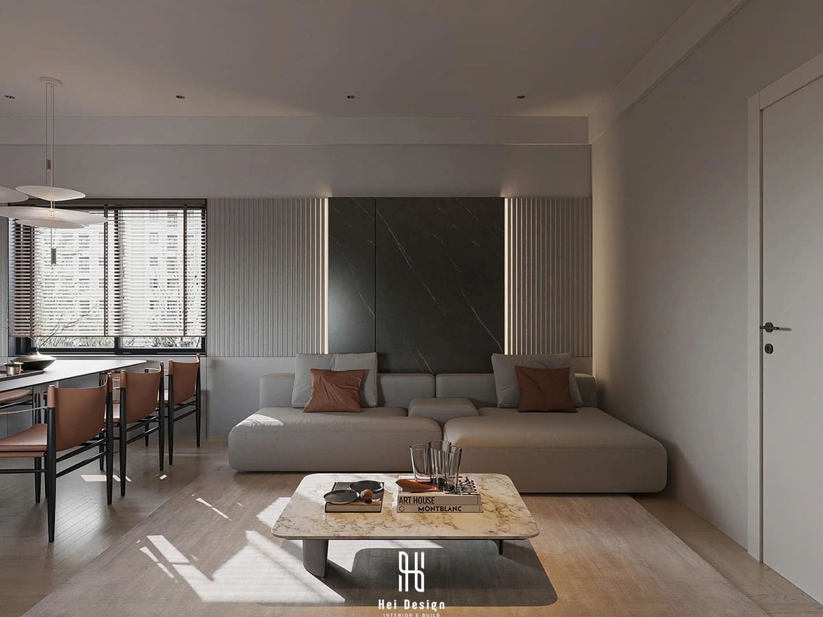 Phòng khách nhà phố Bình Tân thiết kế tối giản với sofa trung tính và bố cục thông thoáng