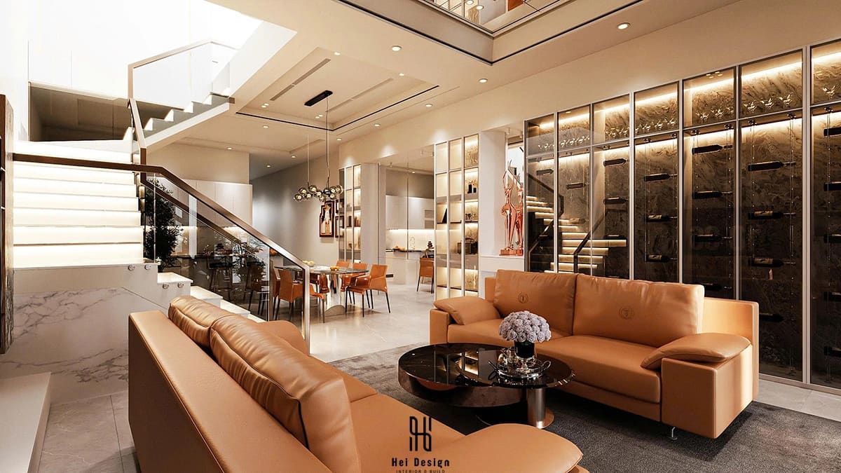 Phòng khách nhà phố Củ Chi phong cách Modern Design với sofa da nâu trần cao và không gian rộng mở