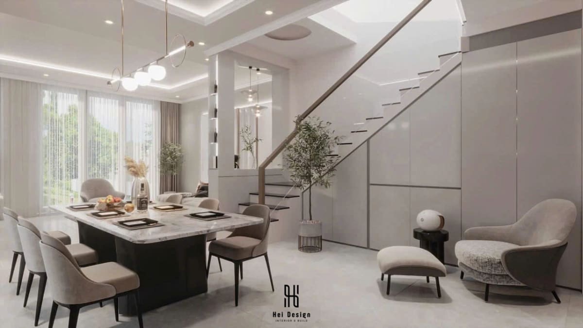 Không gian bàn ăn kết nối cầu thang nhà phố Bình Phước với lan can kính hiện đại