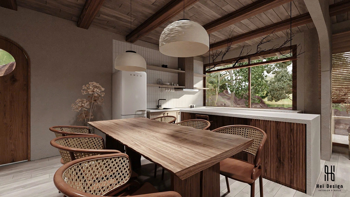 Khu bếp và bàn ăn homestay Wabi Sabi 130m2 – tủ bếp màu sage và bàn gỗ nguyên tấm