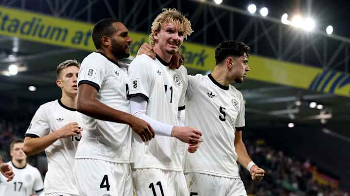 FBL-WC-EUR-2026-QUALIFIER-NIR-GER Germany's striker #11 Nick Woltemade (C) celebrates scoring the team's first goal during the 2026 World Cup Group A qualifying football match between Northern Ireland and Germany at Windsor Park stadium, in Belfast, on October 13, 2025. (Photo by Paul Faith / AFP) (Photo by PAUL FAITH/AFP via Getty Images)