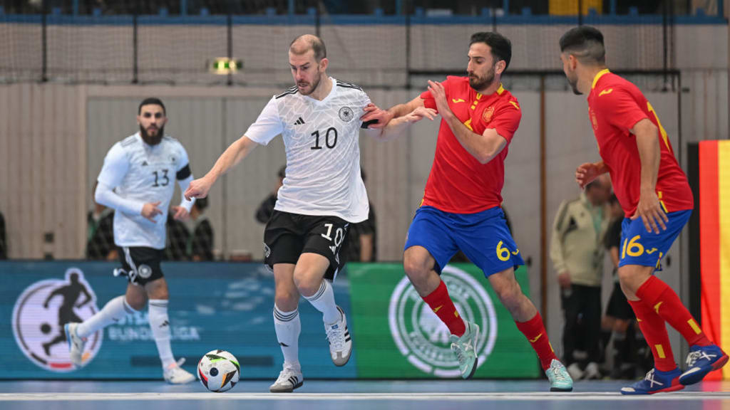 ASCHAFFENBURG, GERMANY - FEBRUARY 04: Michael Meyer of Germany challenges Raul Gomez del Olmo of Spain during the Futsal Friendly match between Germany and Spain at F.a.n. Frankenstolzarena on February 04, 2024 in Aschaffenburg, Germany. (Photo by Christian Kaspar-Bartke/Getty Images for DFB)