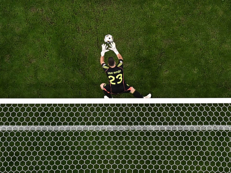 FBL-EURO-2024-MATCH49-ESP-FRA Spain's goalkeeper #23 Unai Simon catches the ball during the UEFA Euro 2024 semi-final football match between Spain and France at the Munich Football Arena in Munich on July 9, 2024. (Photo by Fabrice COFFRINI / AFP) (Photo by FABRICE COFFRINI/AFP via Getty Images)