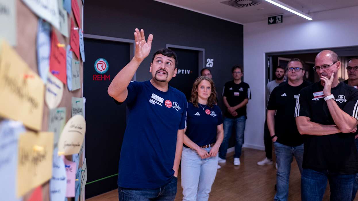 WOLFSBURG, GERMANY - OCTOBER 13: Charly Rokoss speaks during the Club Advisors Event on October 13, 2023 at Volkswagen Arena in Wolfsburg, Germany. (Photo by Oliver Hardt/Getty Images)