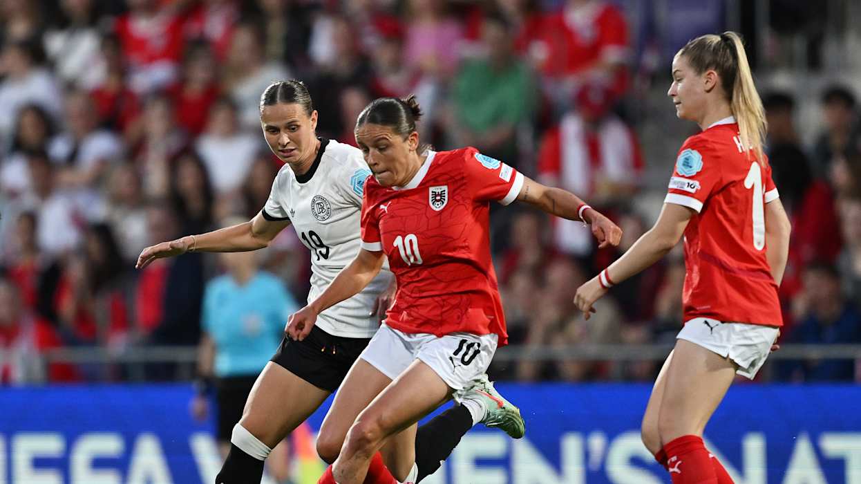VIENNA, AUSTRIA - JUNE 03: Laura Feiersinger of Austria is challenged by Klara Buhl of Germany during the UEFA Women's Nations League 2024/25 Grp A1 MD6 match between Austria and Germany at  on June 03, 2025 in Vienna, Austria. (Photo by Christian Bruna/Getty Images)