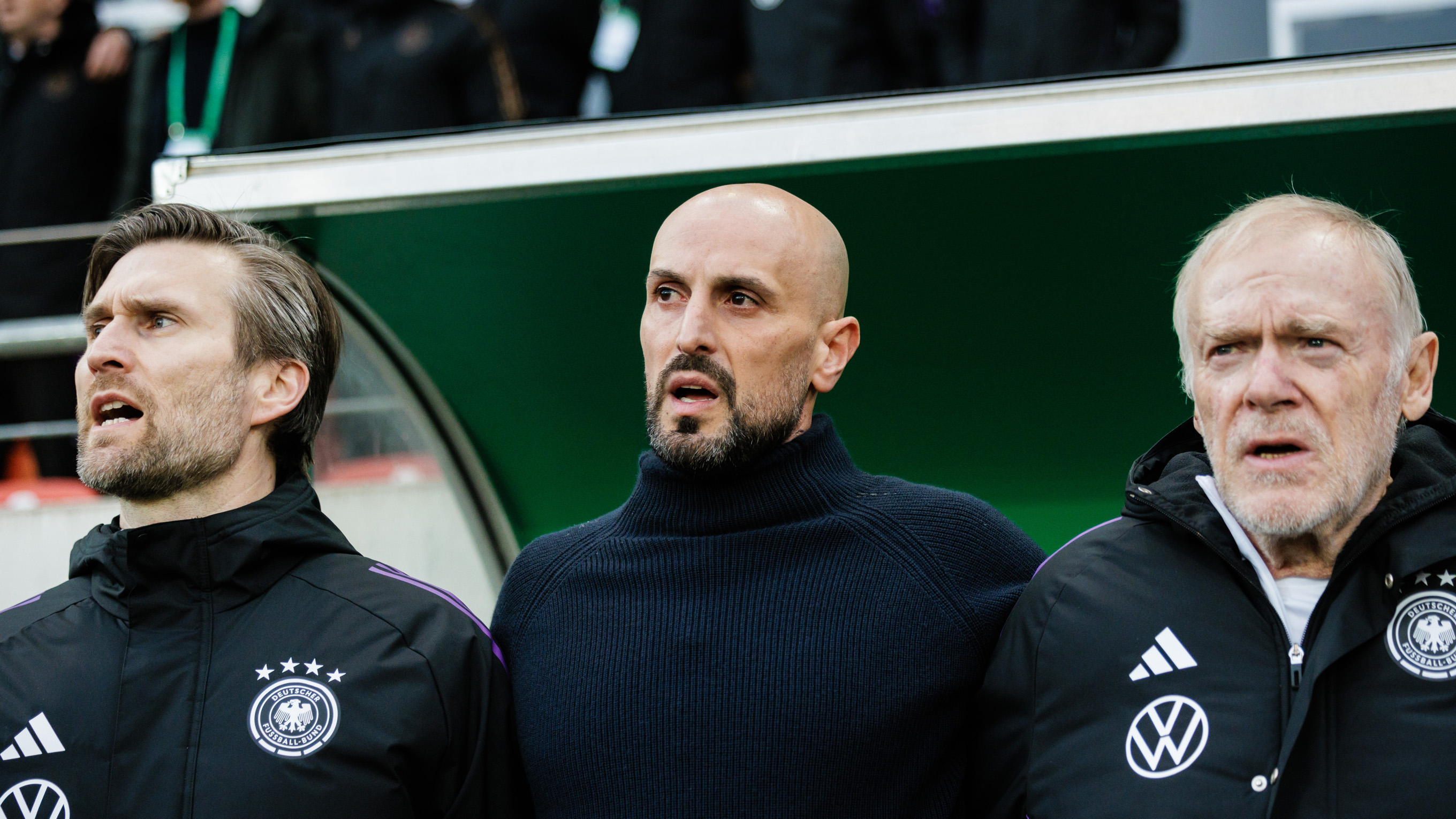 HALLE, GERMANY - MARCH 26: Coach Antonio Di Salvo (C) and assistant coaches Daniel Niedzkowski (L) and Hermann Gerland (R) are seen prior to the UEFA Under21 EURO Qualifier Germany U21 v Israel U21 at Leuna-Chemie-Stadion on March 26, 2024 in Halle, Germany. (Photo by Reinaldo Coddou H./Getty Images) *** Local Caption *** Daniel Niedzkowski, Antonio Di Salvo, Hermann Gerland