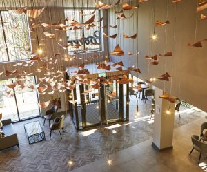 Contemporary copper bird lighting in the IconInc @ Roomzzz York Reception