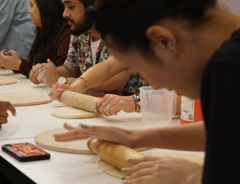 IconInc students making pizza dough with Chris Hale