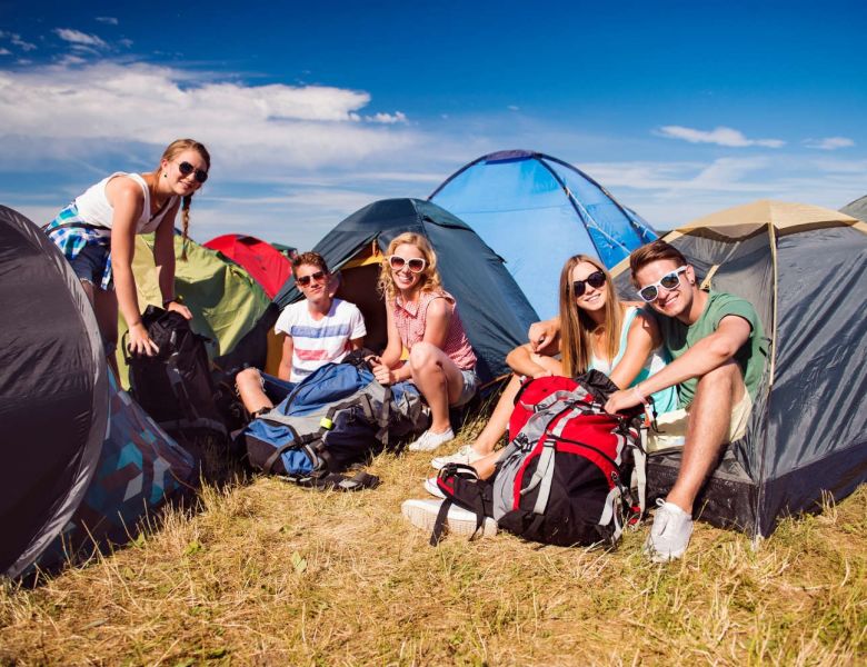 Students camping in the sun at a music festival