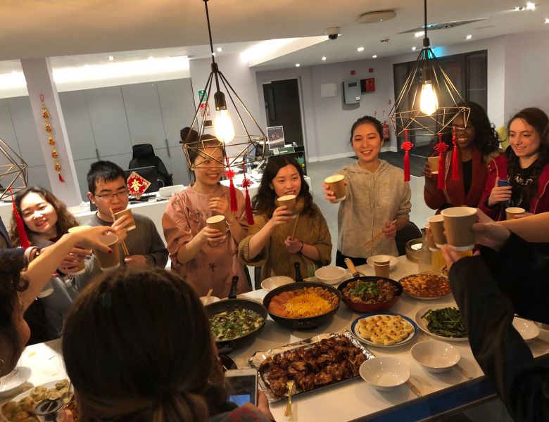 Friends enjoying Chinese new year celebrations at IconInc with food and drink