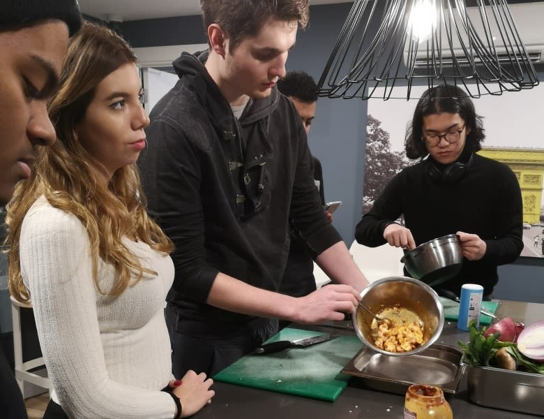 Students learning to cook in the mega kitchen