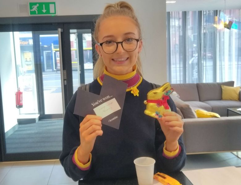 Student at IconInc with easter egg hunt prize